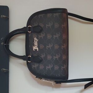 Brand new Juicy couture handbag.brown/ black.jc signature. 11.w 7.5h.